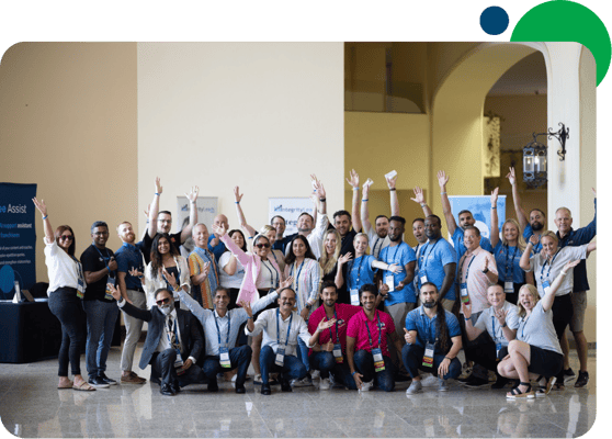 Group photo of WSI consultants raising their hands in a celebratory pose, representing the energy and connection of the global community.