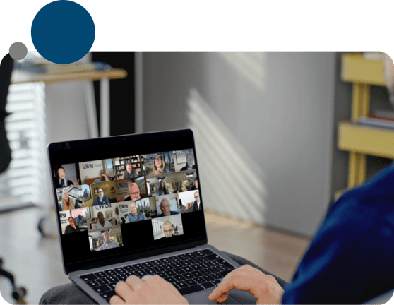 Image of a person attending a virtual training or support session via laptop, symbolizing WSI’s ongoing consultant support and collaboration.