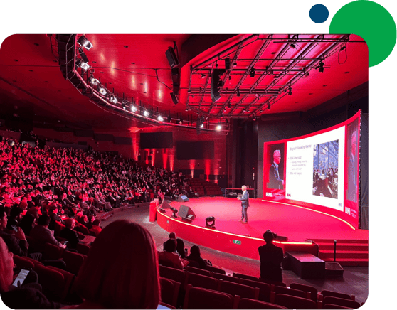 Photo of a keynote speaker presenting at a major AI event, illustrating WSI’s access to leading industry insights through the Keynote Vault.